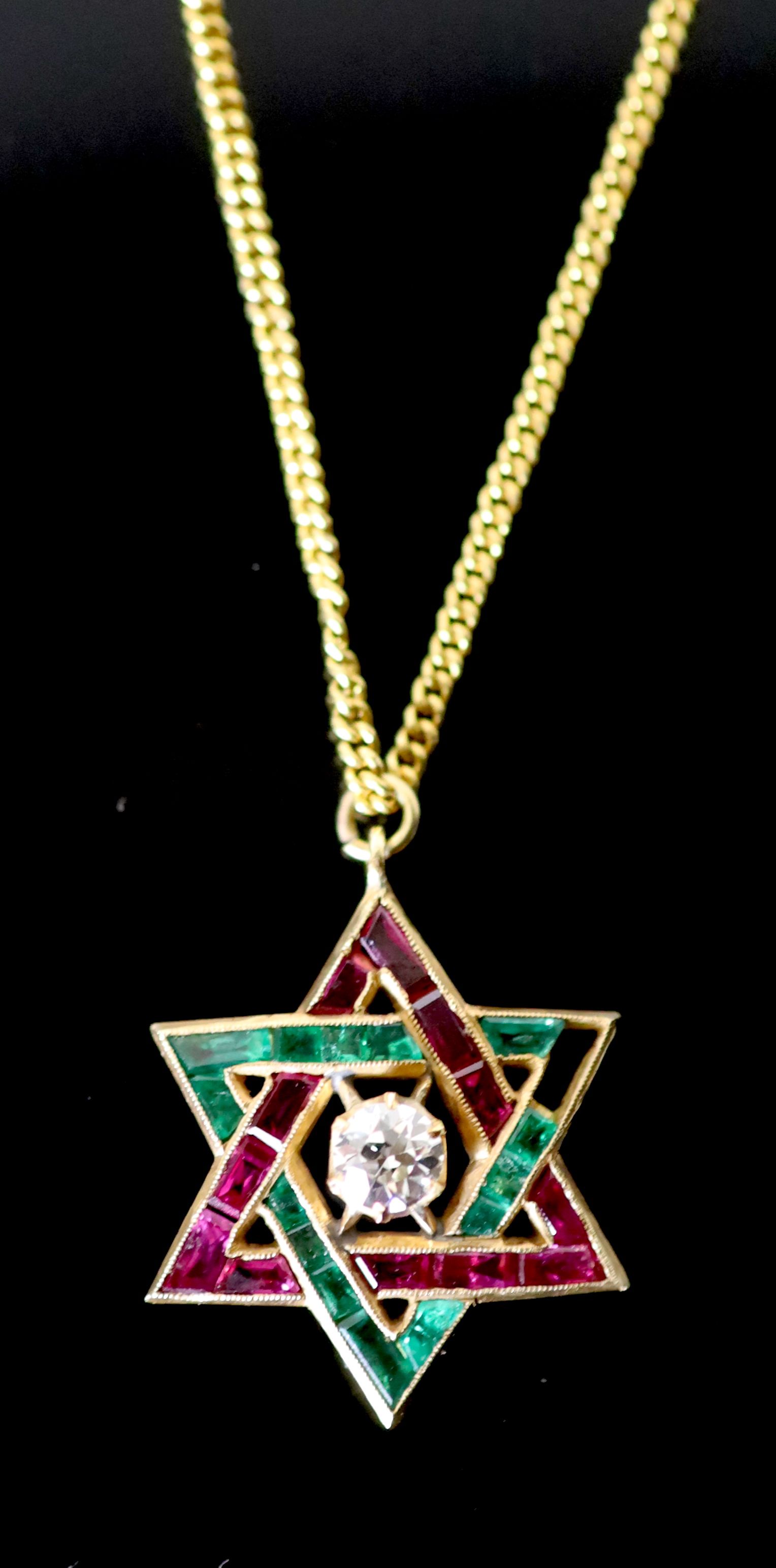 A continental gold, emerald, ruby and diamond set Star of David pendant, on a gold fine link chain,